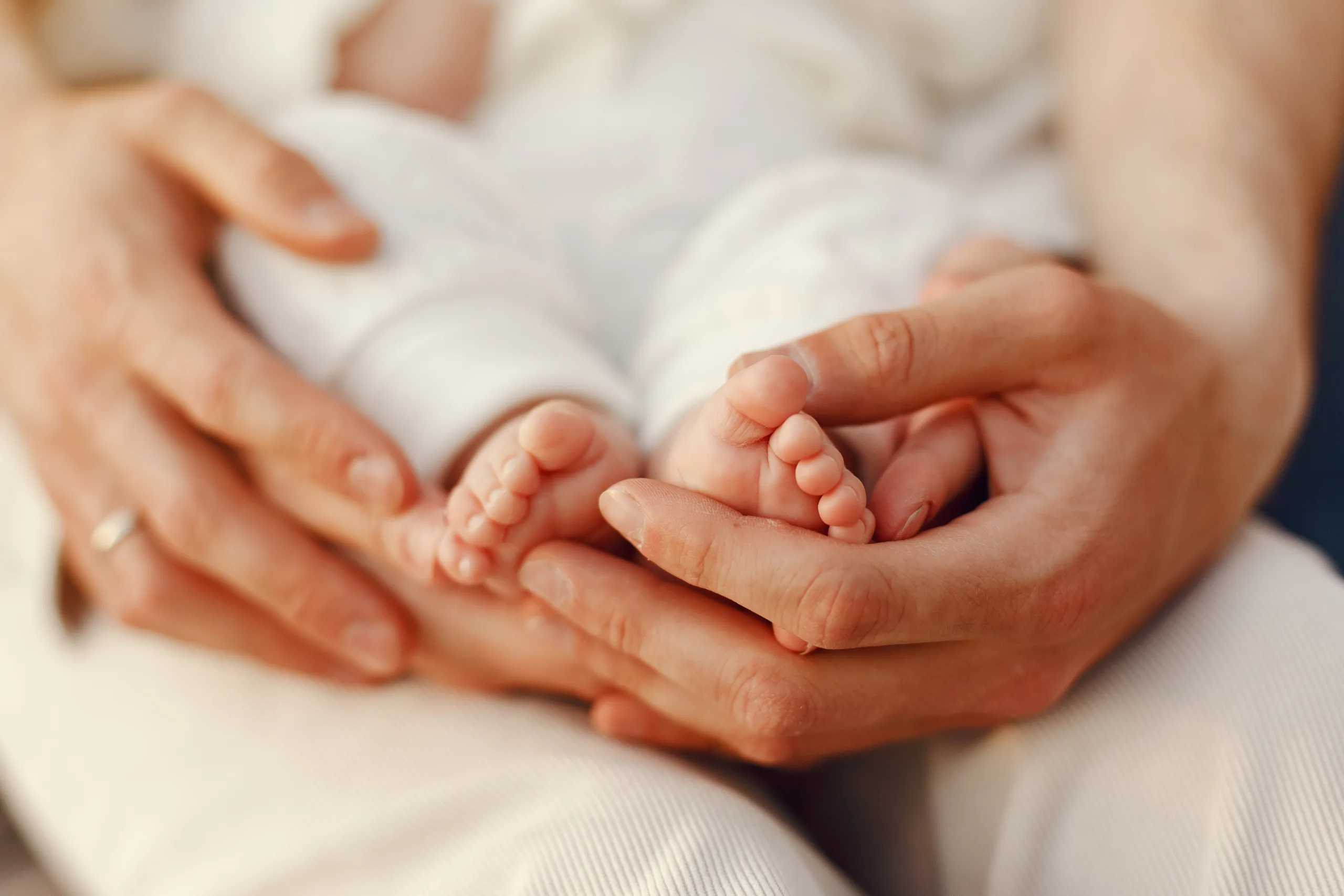 Parents with daughter. Family in a park. Newborn girl.