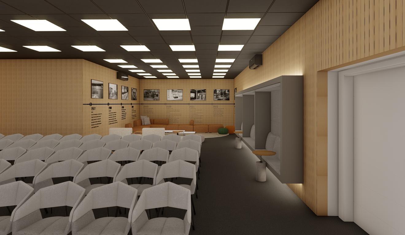 Auditório moderno com fileiras de cadeiras cinzas, detalhes em madeira e iluminação elegante.